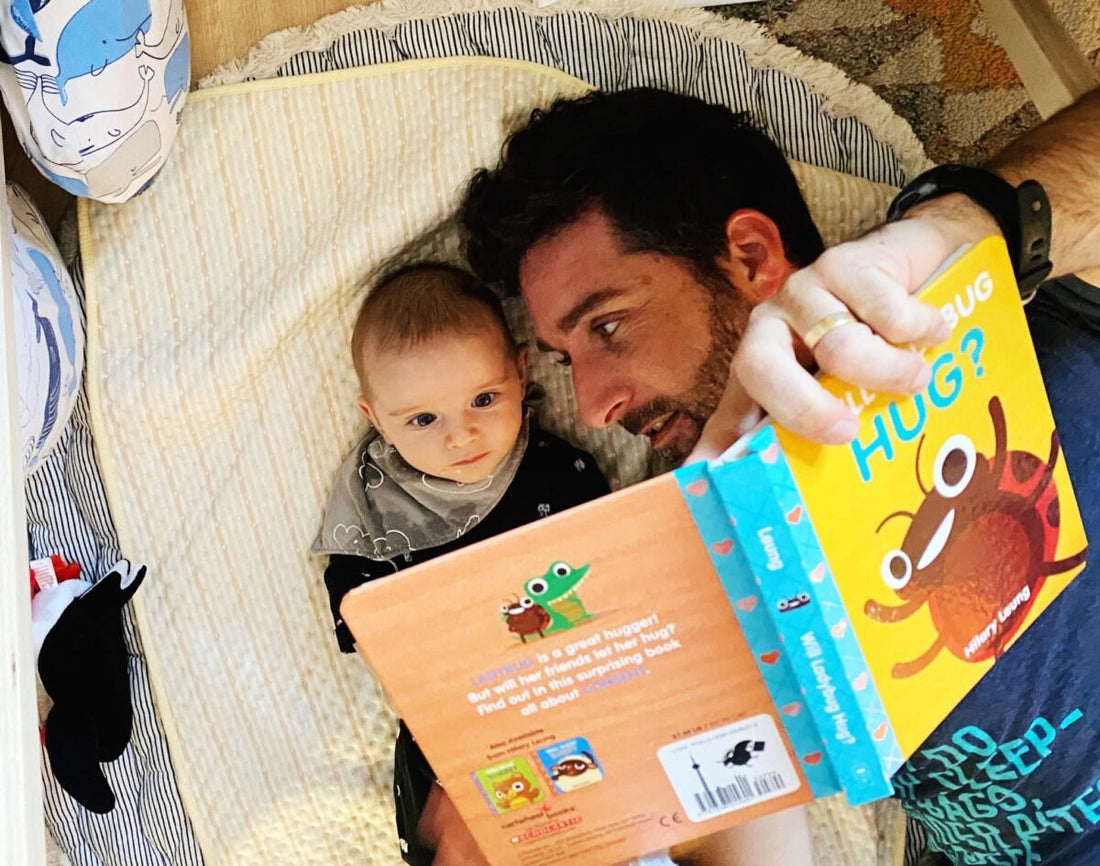 Parent and child reading will lady bug hug