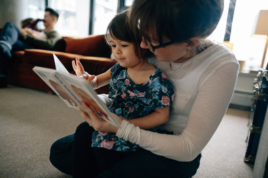 reading classic feminist book with toddler