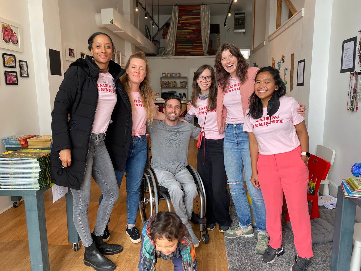 The Little Feminist team gathered together in Raising Feminists shirts