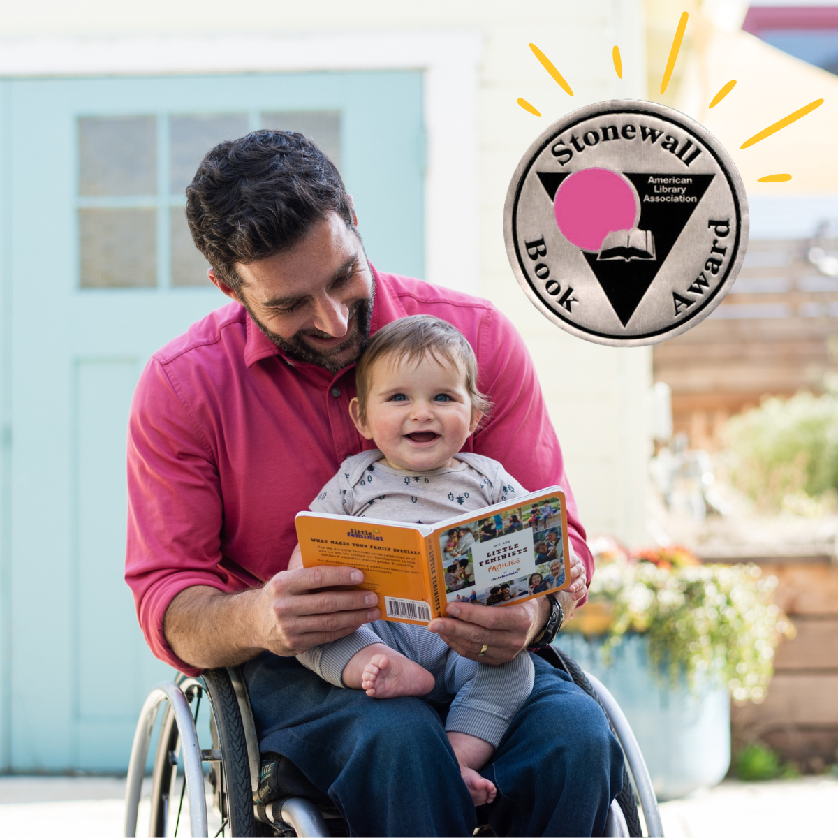 A dad and child reading We Are Little Feminists, with the Stonewall Award seal