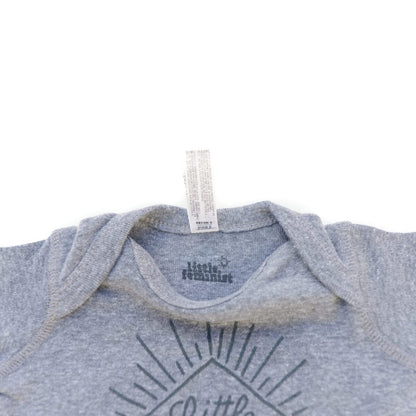 Little Feminist grey onesie inside label