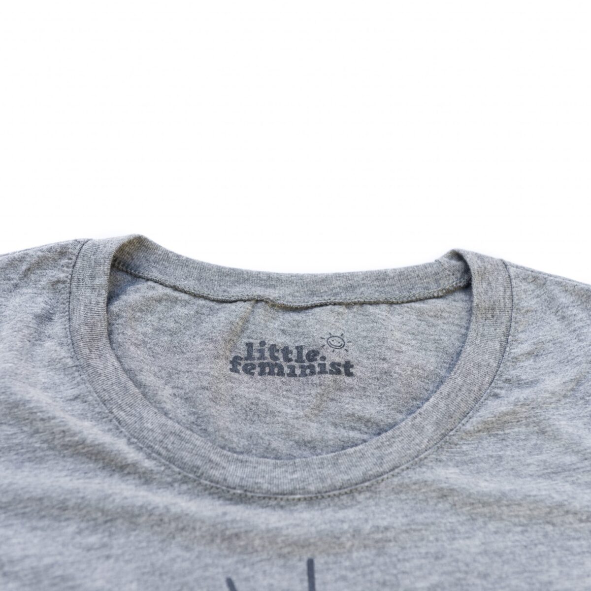 Raising Little Feminists grey women's shirt inside label