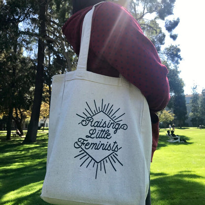 Raising Little Feminists book tote in action