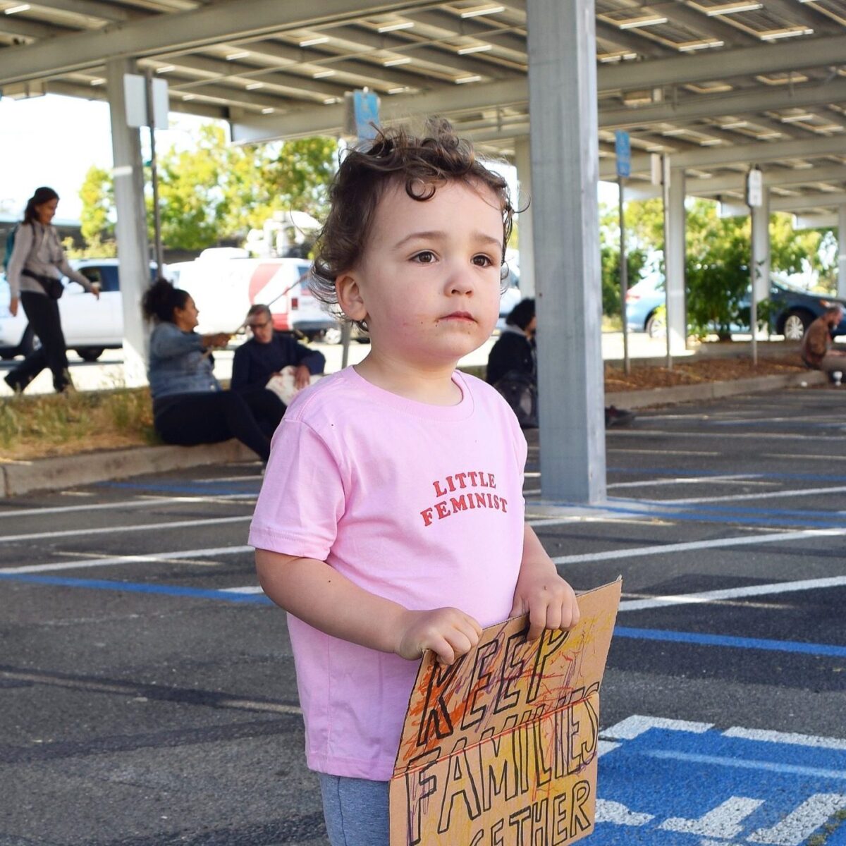 Little Feminist pink kid's shirt in action