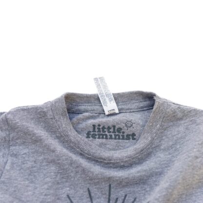 Little Feminist grey kid's shirt inside label