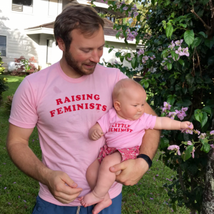 Raising Feminists pink men's shirt in action